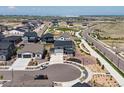 This aerial view shows the layout of the community with green spaces and sidewalks for pedestrians at 3453 N Gold Bug Ct, Aurora, CO 80019
