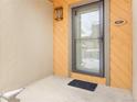 Covered front porch featuring a glass door with black trim and vertical siding at 12655 W Bayaud Ave # 40, Lakewood, CO 80228