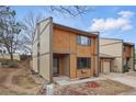 Two-story home featuring warm siding, a two-car garage, and a well-maintained lawn at 12655 W Bayaud Ave # 40, Lakewood, CO 80228