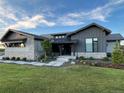 Craftsman home with stone accents, manicured lawn, and charming curb appeal at 6736 S Flanders Ct, Aurora, CO 80016