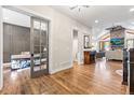 Inviting foyer with hardwood floors leading to the study and a spacious living room at 731 Weston Rd, Larkspur, CO 80118