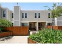 Charming townhouse with well-maintained landscaping and a private fenced yard at 1050 S Monaco Pkwy # 125, Denver, CO 80224