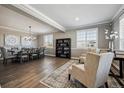 Formal dining room featuring a large table, elegant decor, and ample natural light at 21854 Tyrolite Ave, Parker, CO 80138