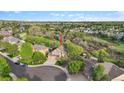 Drone shot showcasing property nestled in a community with natural green space at 22302 Quail Run Way, Parker, CO 80138