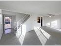 Bright living room with stairs and entryway view at 4974 E 124Th Way, Thornton, CO 80241