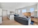 Spacious open-concept living space with modern kitchen and dining area at 1300 N Ogden St # 304, Denver, CO 80218
