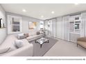 Bright living area with a modern L-shaped sofa, natural light, and neutral tones at 1593 W 166Th Ave, Broomfield, CO 80023