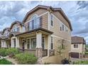 Charming townhome with a inviting front porch and stone accents at 1436 Turnberry Dr, Castle Rock, CO 80104