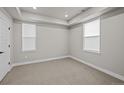 Neutral bedroom with large windows and carpeted floors, ready for personalization and decor at 16605 Peak St, Broomfield, CO 80023