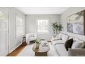 Bright living room featuring hardwood floors and lots of natural light at 2970 Leyden St, Denver, CO 80207