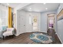 Inviting entryway features a stylish rug, modern door, and an abundance of natural light at 3522 N Buchanan Way, Aurora, CO 80019