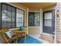 Charming front porch featuring a cozy seating area, blue accents, and a warm welcome at 4713 Spine Rd # D, Boulder, CO 80301