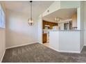 Dining area featuring modern light fixture, room to entertain and open floorplan at 5705 N Genoa Way # 308, Aurora, CO 80019