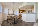 Dining area featuring modern light fixture, room to entertain and open floorplan at 5705 N Genoa Way # 308, Aurora, CO 80019
