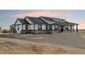 Beautiful single-story home with a stone facade and covered porch; a charming exterior design at 30355 E 161St Ave, Brighton, CO 80603