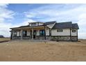 Inviting single-story home with stone accents and a welcoming covered porch; perfect curb appeal at 30355 E 161St Ave, Brighton, CO 80603