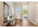 Inviting entryway featuring hardwood floors and a view to the bedroom at 5930 S Platte Canyon Dr, Littleton, CO 80123