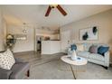 Inviting living area with a comfortable sofa and open view into the kitchen at 10784 W 63Rd Pl # 204, Arvada, CO 80004