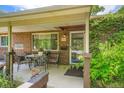Inviting covered front porch with seating area, showcasing the home's address and a welcoming entrance at 4365 Kendall St, Wheat Ridge, CO 80033