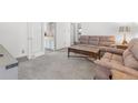 Comfortable living room with neutral carpet and plush furniture at 2112 S Olathe St, Aurora, CO 80013