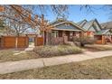 Brick home with fenced yard and mature landscaping at 579 S Sherman St, Denver, CO 80209