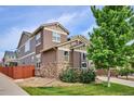 A view of the side of the home, showcasing the yard and fence at 10397 Helsinki St, Parker, CO 80134