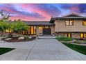 Warm and inviting home exterior with a charming front door, manicured landscaping, and elegant curb appeal at 5727 Colorow Dr, Morrison, CO 80465