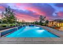 Inviting swimming pool with a manicured lawn and comfortable patio seating perfect for entertaining at 5727 Colorow Dr, Morrison, CO 80465