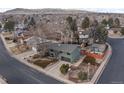 An aerial view of a home highlighting its location, landscaping, and neighborhood at 2490 S Coors St, Lakewood, CO 80228