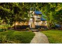 Beautiful home featuring an artful stone exterior, manicured lawn, and inviting entrance at 1525 W 141St Way, Westminster, CO 80023