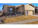 Lovely home with a well-maintained lawn and inviting curb appeal at 22046 E Allenspark Pl, Aurora, CO 80016