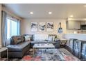 Inviting living room featuring stylish furniture, decor and natural light at 5316 Stuart St, Denver, CO 80212