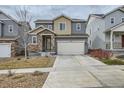 Charming two-story home with stone accents, attached garage, and easy-care landscaping at 15226 W 93Rd Ave, Arvada, CO 80007