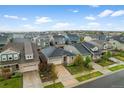 Community aerial view showcasing multiple homes with well-maintained lawns and manicured landscapes at 452 S Norfolk Ct, Aurora, CO 80017