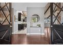 Inviting foyer with dark wood floors, opening to the kitchen and living spaces at 21859 Grandview Ave, Golden, CO 80401