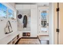 Well-organized mudroom with built-in storage, a bench, and plenty of natural light at 3039 N Milwaukee St, Denver, CO 80205