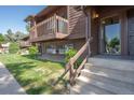 Beautiful multi-level townhouse features a balcony, well-maintained landscaping, and a welcoming entrance at 2636 Juniper Ave # 39-1, Boulder, CO 80304