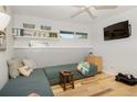 Cozy room with wood floors, built-in shelves, and a comfortable sofa perfect for relaxing and entertainment at 2636 Juniper Ave # 39-1, Boulder, CO 80304