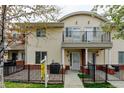 Inviting two-story home with a balcony and fenced yard, perfect for outdoor enjoyment and curb appeal at 7450 Lowell Blvd # B, Westminster, CO 80030