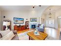 Bright and airy living room with hardwood floors, fireplace, and a welcoming open layout at 6449 E 163Rd Ave, Brighton, CO 80602