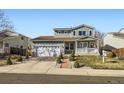 Charming two-story home featuring a two-car garage, inviting front porch, and landscaped front yard at 2175 E 126Th Way, Thornton, CO 80241