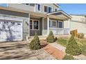 Charming two-story home featuring a two-car garage and inviting front porch at 2175 E 126Th Way, Thornton, CO 80241
