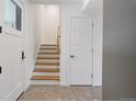Bright hallway featuring a staircase, tiled floor and modern doors at 2160 Folsom St, Boulder, CO 80302