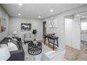 Bright living room with neutral walls, recessed lights and stylish decor at 2696 S Grove St, Denver, CO 80219