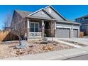 Inviting single-Gathering home with a well-kept front yard, quaint porch, and convenient three-car garage at 14232 Elm St, Thornton, CO 80602
