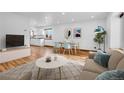 Inviting living room that features a dining area, hardwood floors and an open concept layout at 4678 S Salida St, Aurora, CO 80015