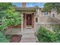 Close-up of the front door with brick surround, leading to a welcoming entrance at 2713 W Long Dr # C, Littleton, CO 80120
