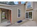 Private patio area with exterior door to kitchen at 2713 W Long Dr # C, Littleton, CO 80120