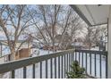 Balcony view featuring neighborhood landscape and bare trees under winter sky at 1760 S Ammons St # D, Lakewood, CO 80232