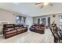 Inviting living room with cozy seating, wood-look floors, and ample natural light at 1760 S Ammons St # D, Lakewood, CO 80232